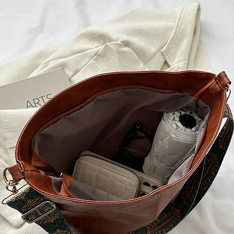 Everyday women's accessory: a chic boho shoulder bag, hobo style, with a fashionable patterned strap.