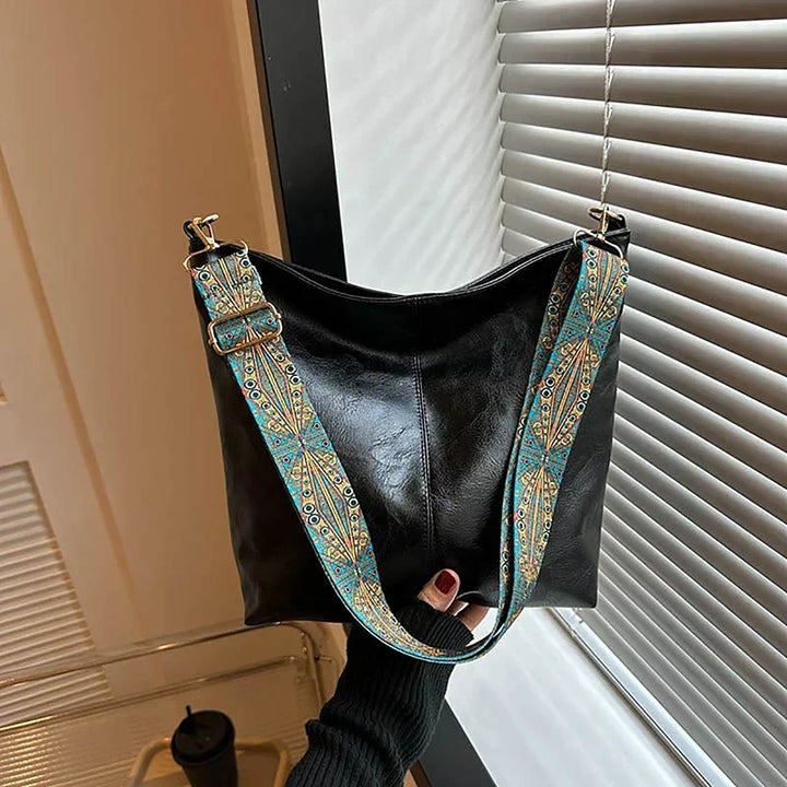 Versatile women's boho shoulder bag, hobo style, with a trendy patterned strap for chic everyday wear.