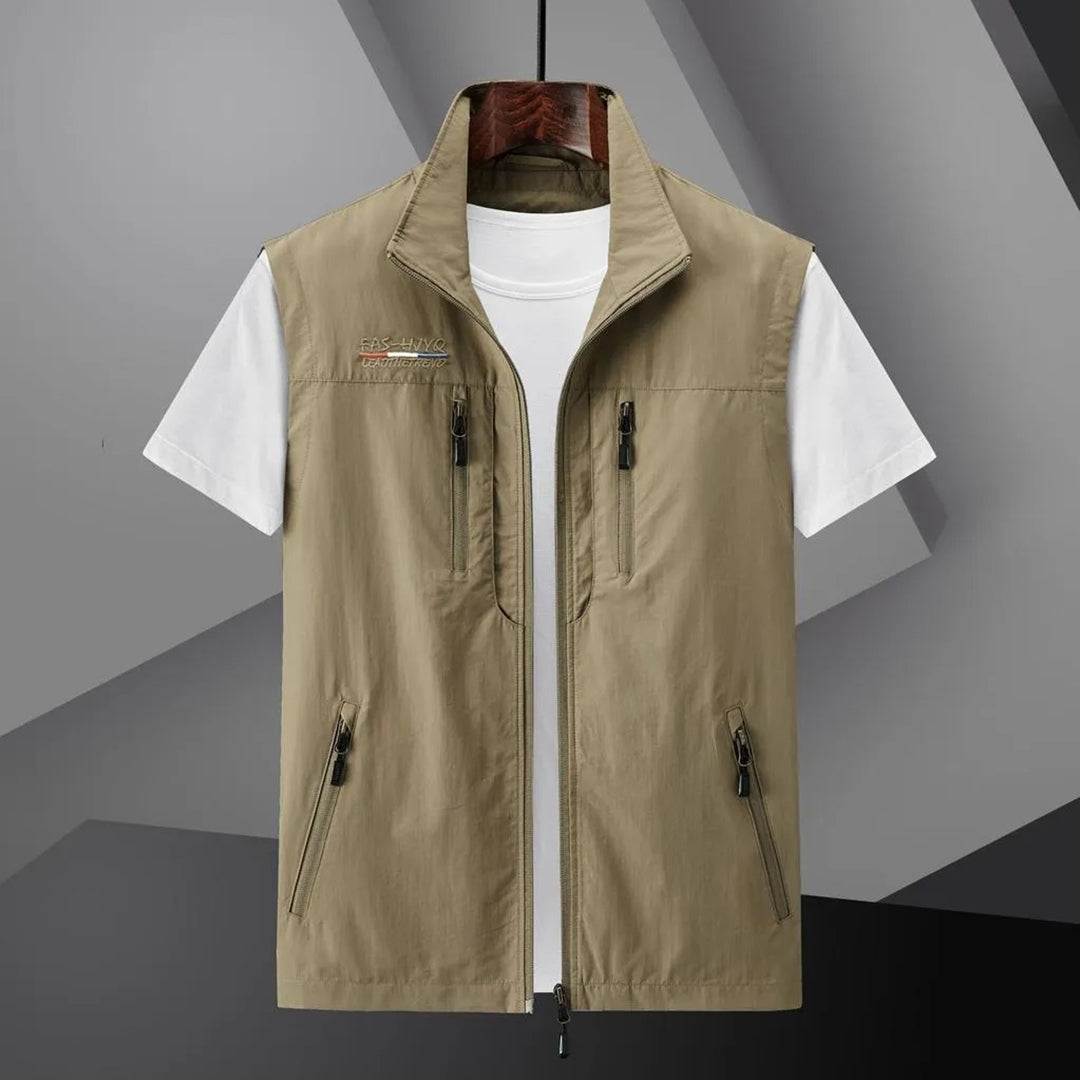 Versatile men's adventure vest: lightweight, multi-pocket for travel, hiking, fishing & outdoor utility.