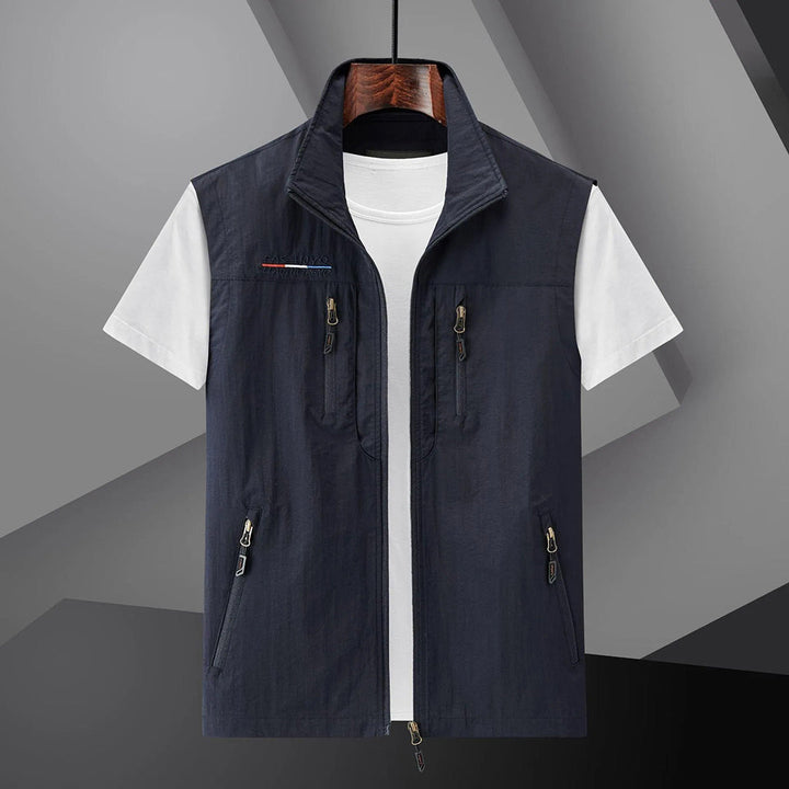 Men's lightweight adventure utility vest with multiple pockets for outdoor activities & travel.