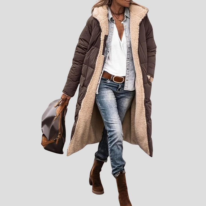 Fashionable women's reversible hooded winter coat. Enjoy dual styles and stay warm with this stylish outerwear.