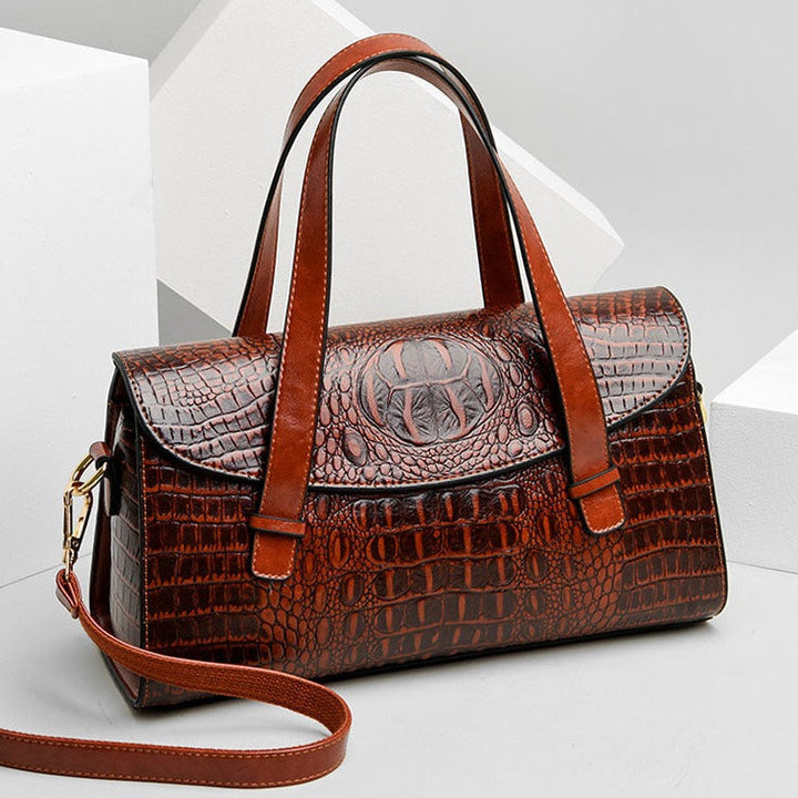 Chic black crocodile embossed women's crossbody bag. Elegant design, perfect for any occasion.