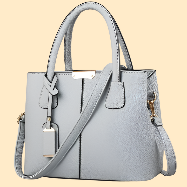 Women's elegant satchel handbag with structured silhouette. Versatile shoulder bag or hand carry purse for any occasion.