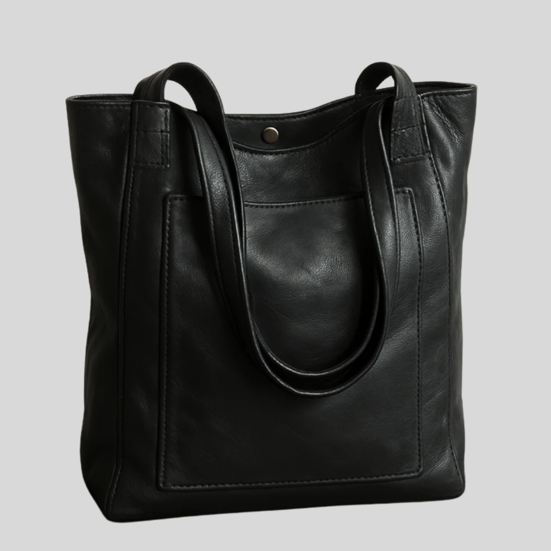 Sophisticated women's elegant tote bag. Offers organized storage and an adjustable strap for cross-body or shoulder carry.