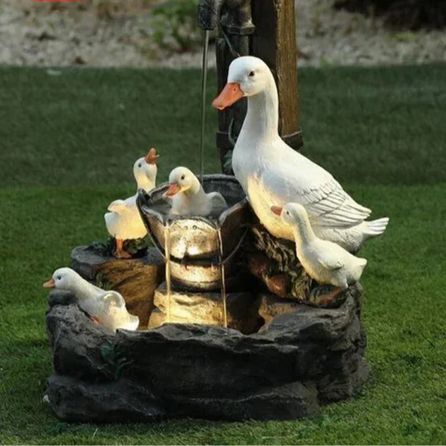 Charming solar duck & squirrel garden fountain with LED light. Weatherproof resin statue, perfect for patio & pond decor.