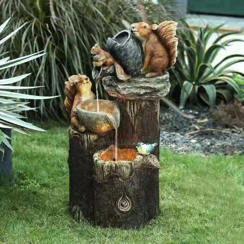 Eco-friendly solar duck & squirrel garden fountain with LED light. Weatherproof resin for charming outdoor & patio decor.