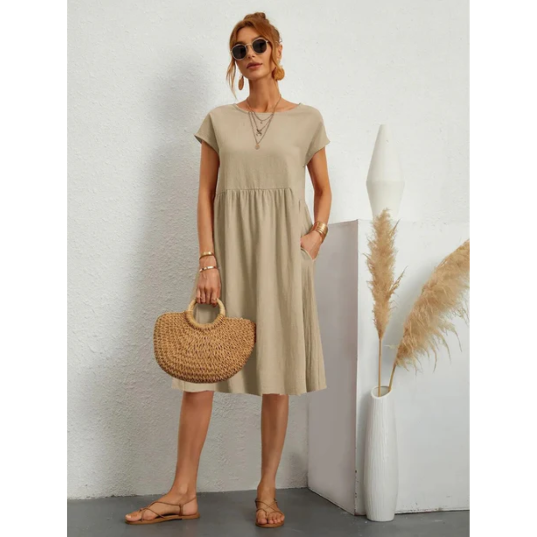 Elegant women's cap sleeve midi dress, A-line cut, round neck, with practical pockets for everyday.