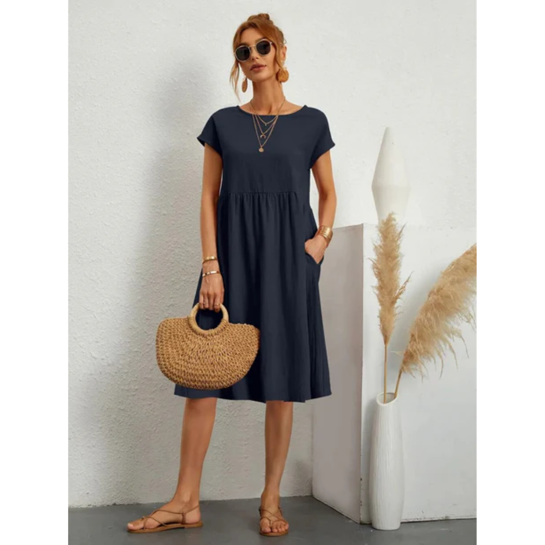 Casual women's summer dress, A-line midi length, cap sleeves, round neck, and handy pockets.