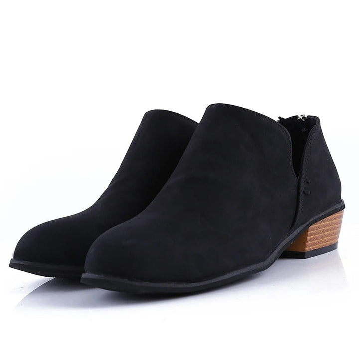 Stylish women's ankle boots with a low block heel, trendy back zip, and comfortable rounded toe for any outfit.