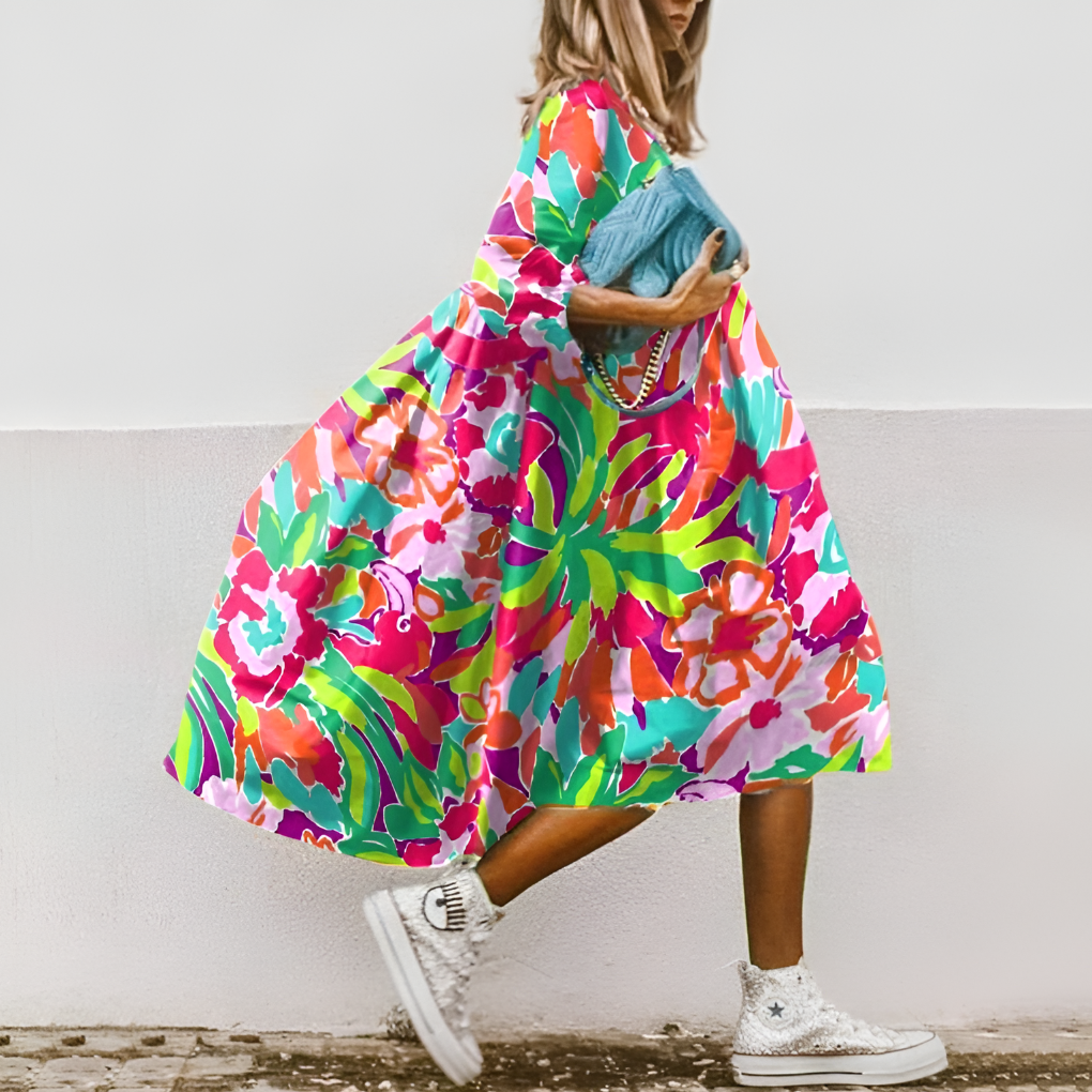 Women's chic floral print midi dress with puff sleeves & a stylish A-line silhouette. Versatile for spring & summer.