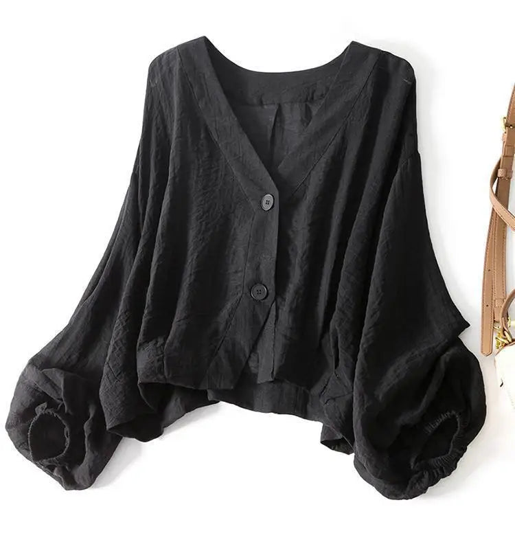 Loose fit women's flowy batwing summer blouse, comfortable casual wear with elegant button detail.