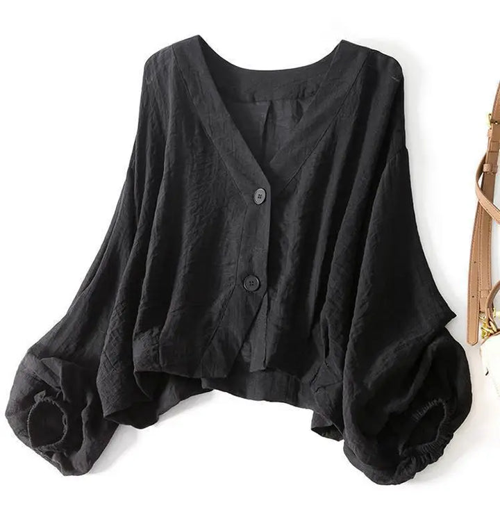 Loose fit women's flowy batwing summer blouse, comfortable casual wear with elegant button detail.