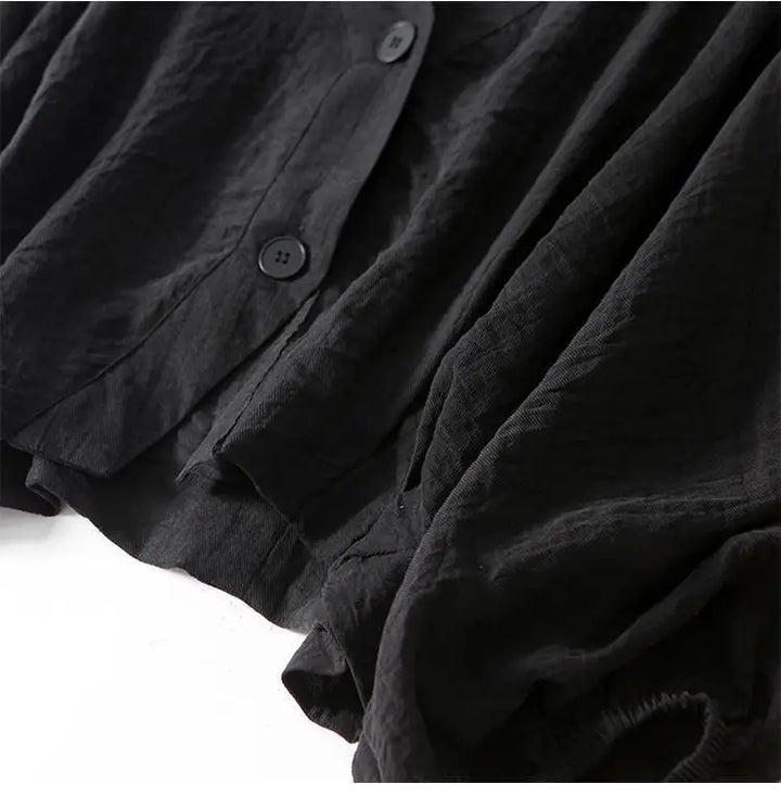 Flowy women's batwing summer blouse, a comfortable loose-fit top with stylish button detail for casual wear.