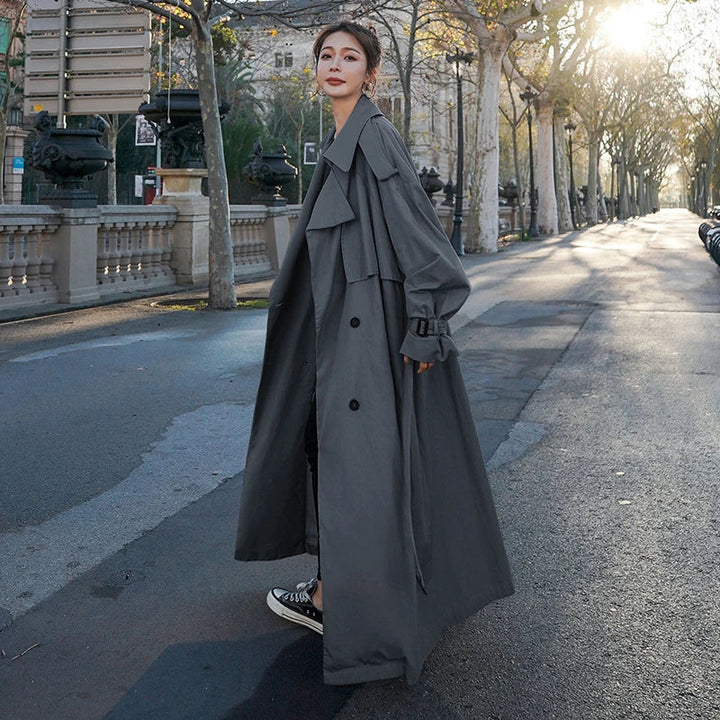 Oversized long trench coat for women, offering a fashionable and comfortable loose fit for any occasion.
