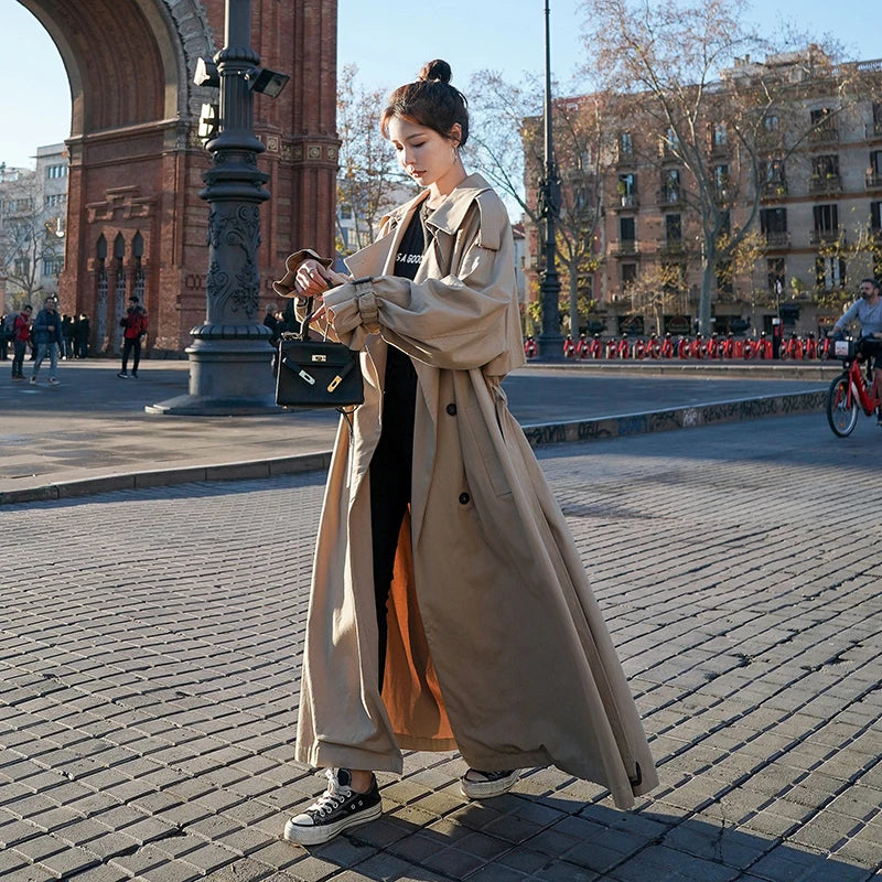 Stylish women's long trench coat featuring a comfortable loose fit, an essential for chic casual outfits.