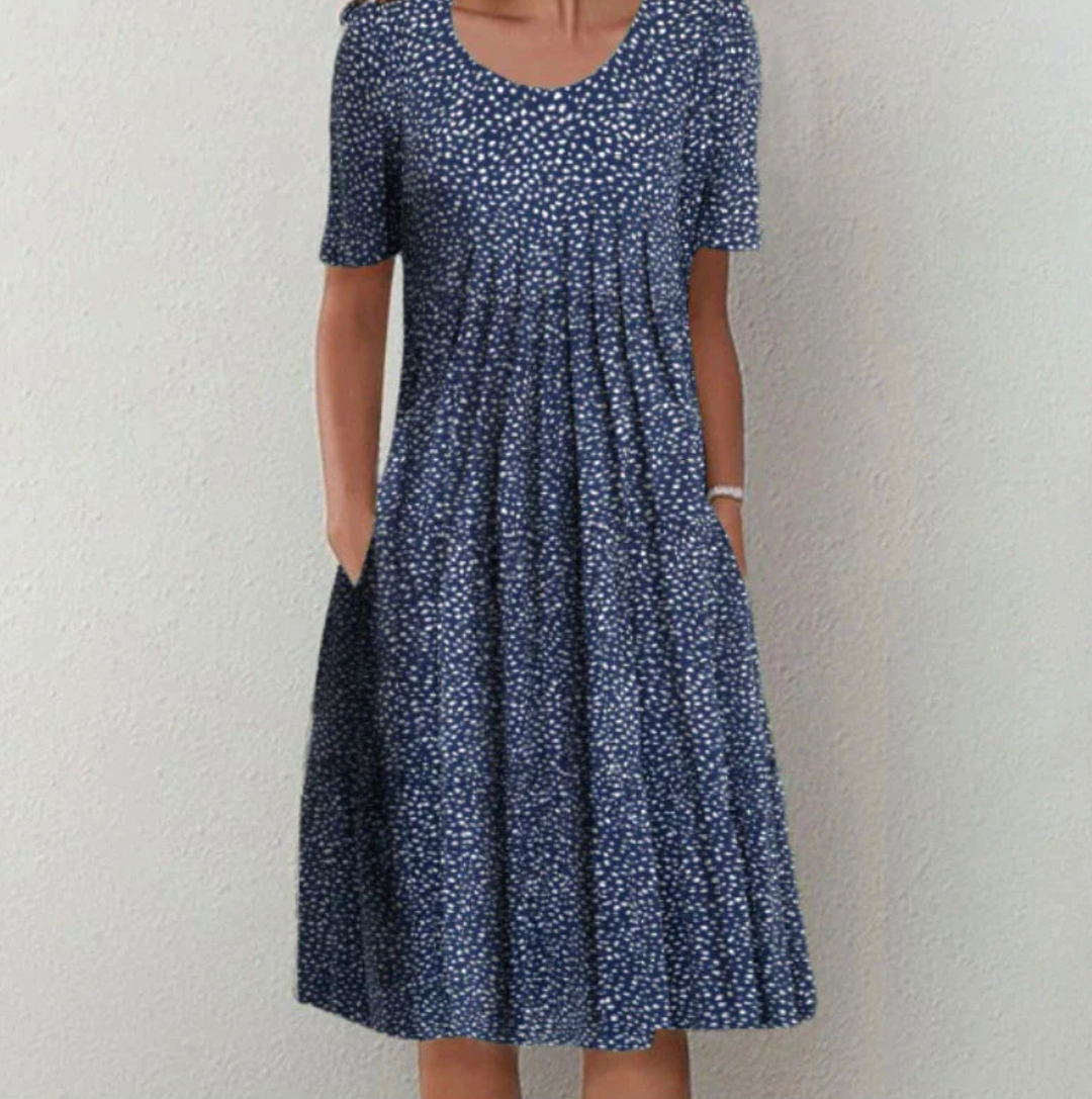 Flowy bohemian printed A-line sundress for women, featuring comfortable pleats, ideal for summer vacations.