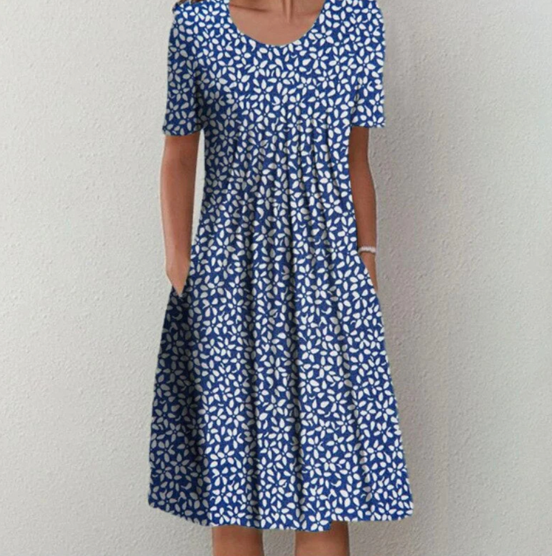 Elegant women's pleated A-line midi dress with chic print, a comfortable and stylish choice for summer fashion.
