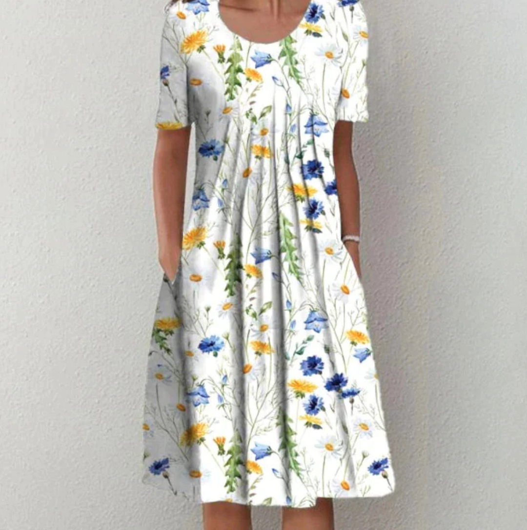 Stylish women's printed pleated A-line summer dress, versatile for casual outings, beach, or elegant everyday fashion.