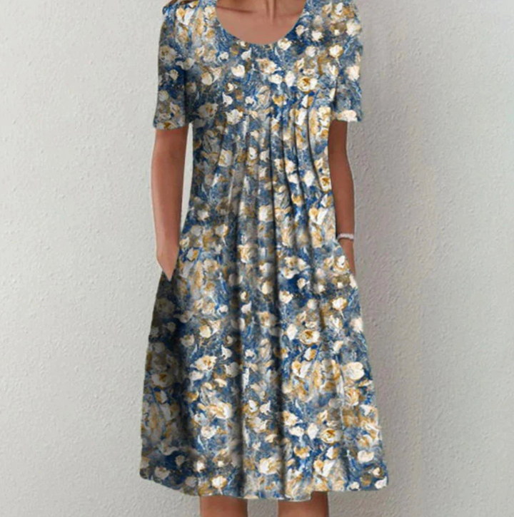 Vibrant printed A-line pleated midi summer dress for women, a comfortable and chic flowy design for any occasion.