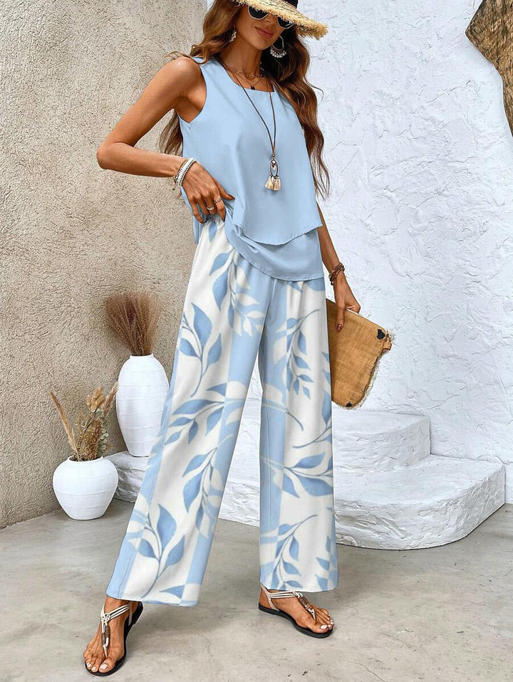Comfortable women's summer set featuring a flowy top & wide-leg pants. Stylish two-piece for warm weather.