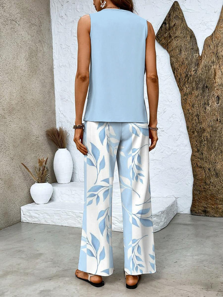 Women's fashion set: elegant flowy top with wide-leg pants. Ideal two-piece summer outfit for ladies.