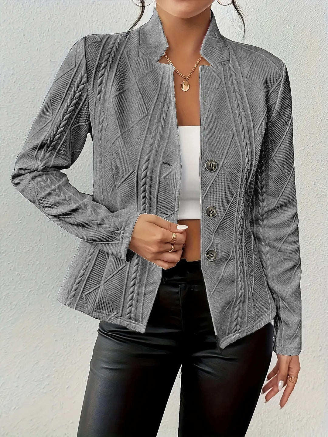 Feminine women's tailored blazer, a versatile wardrobe essential for elegant workwear and chic smart casual ensembles.