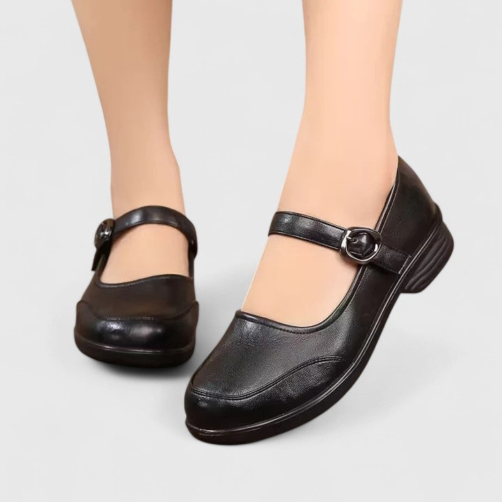 Side view of women's comfortable buckle flats, showcasing the sleek profile
