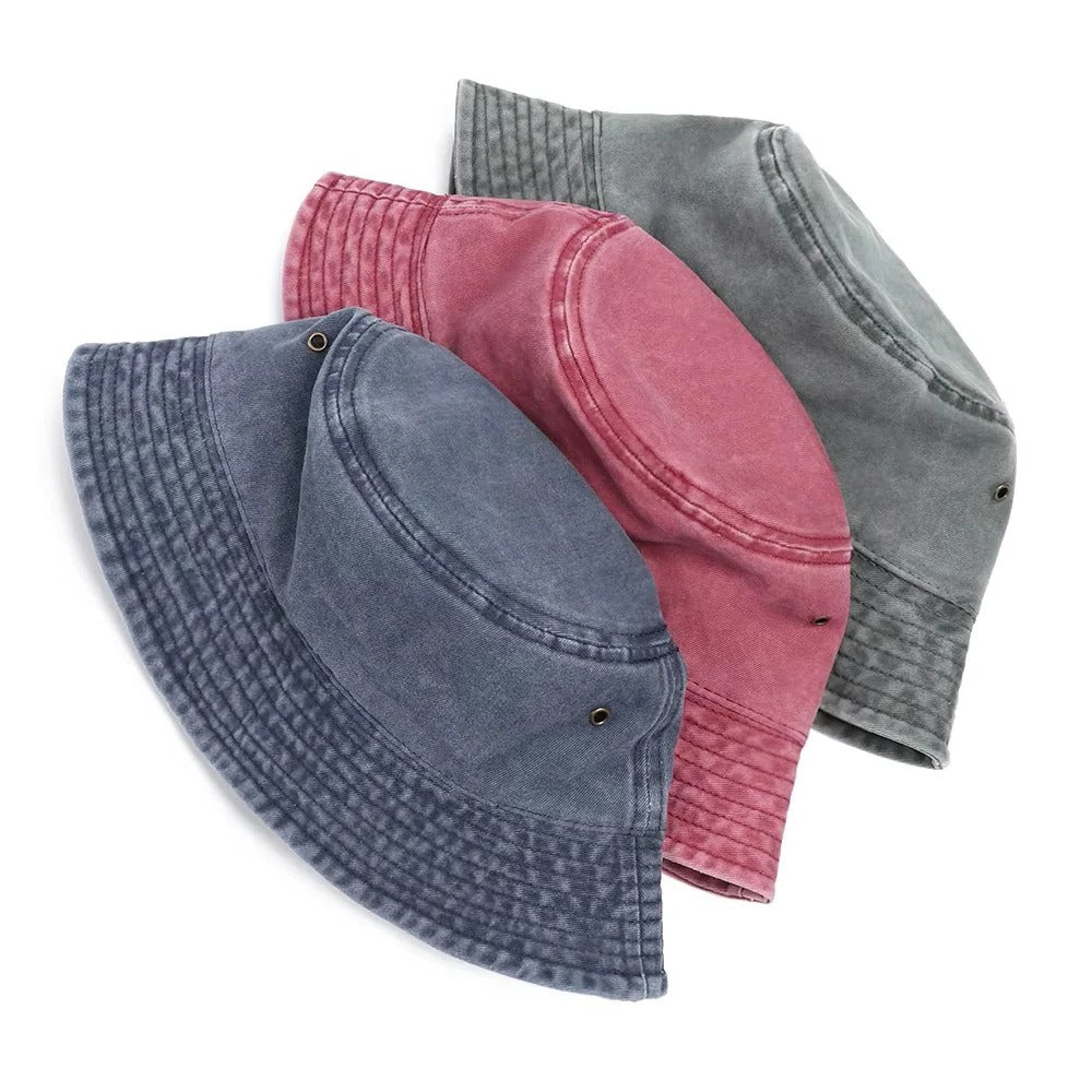 Foldable cotton denim bucket hat, a practical and stylish unisex accessory for travel and sun protection.