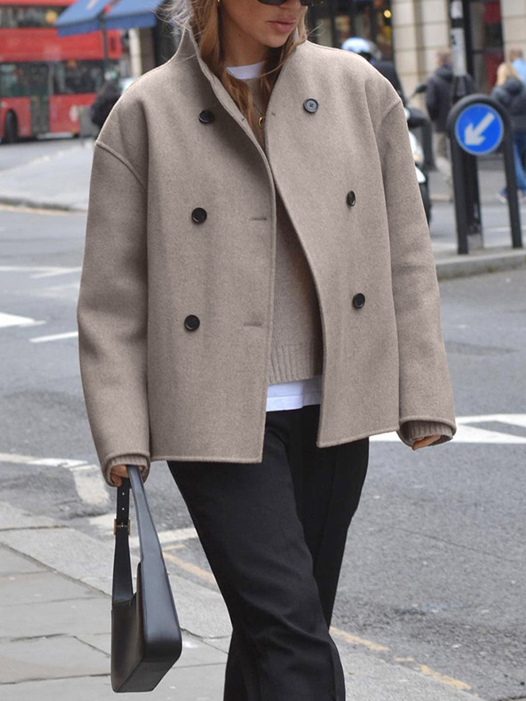 Warm women's double-breasted trench coat, a classic and essential piece of outerwear