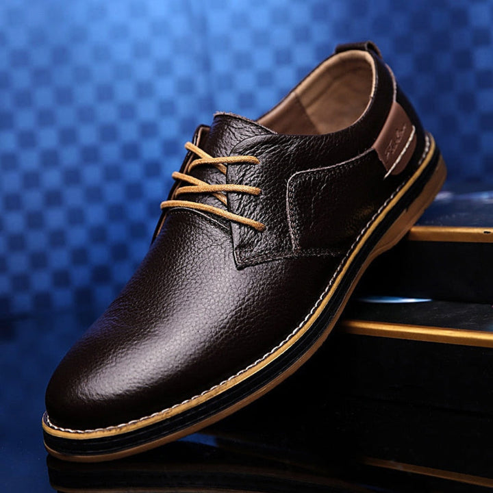 Classic men's black Oxford dress shoes, perfect for formal events & business. Timeless design, comfortable fit, waterproof.