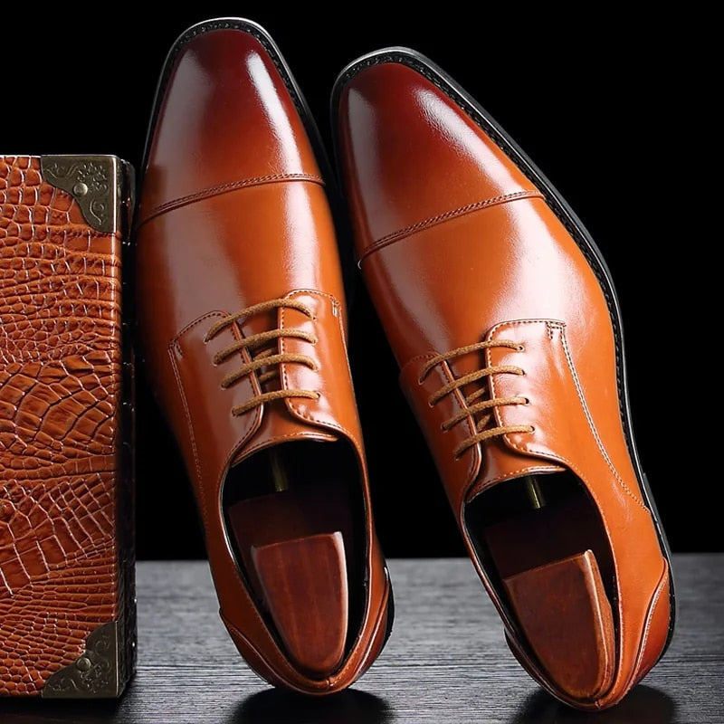 Classic men's Oxford dress shoes. Timeless lace-up formal footwear for sophisticated business casual style.