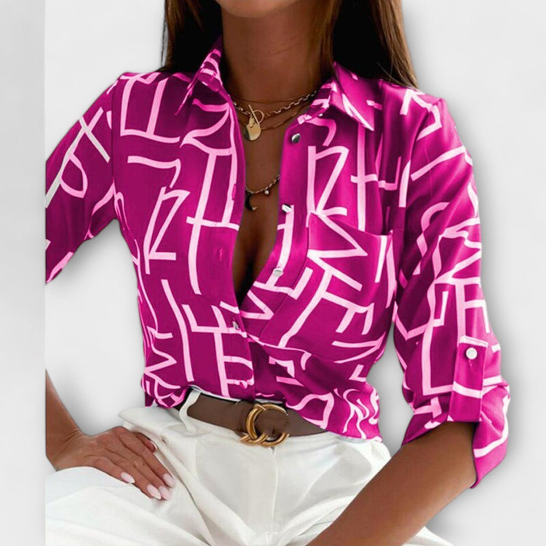Fashionable women's top with classic collar, long sleeve, offering versatile styling.
