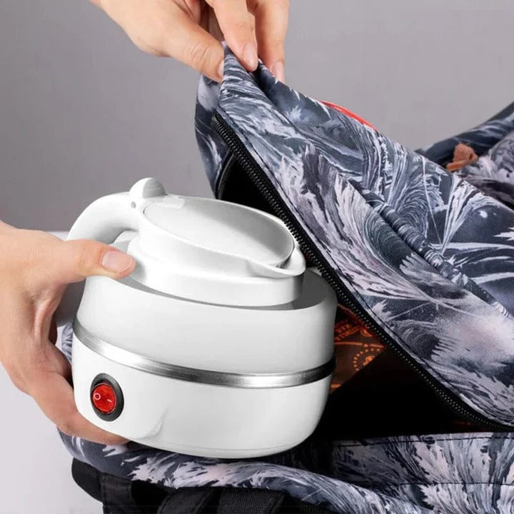 Open TavvitaImp011 portable collapsible electric travel kettle, showcasing silicone body & stainless steel.