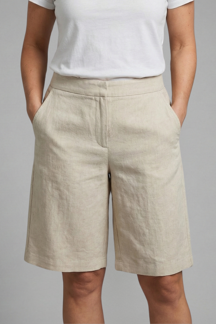 Stylish women's knee-length summer shorts with elastic waist, offering comfort & convenience with side pockets.