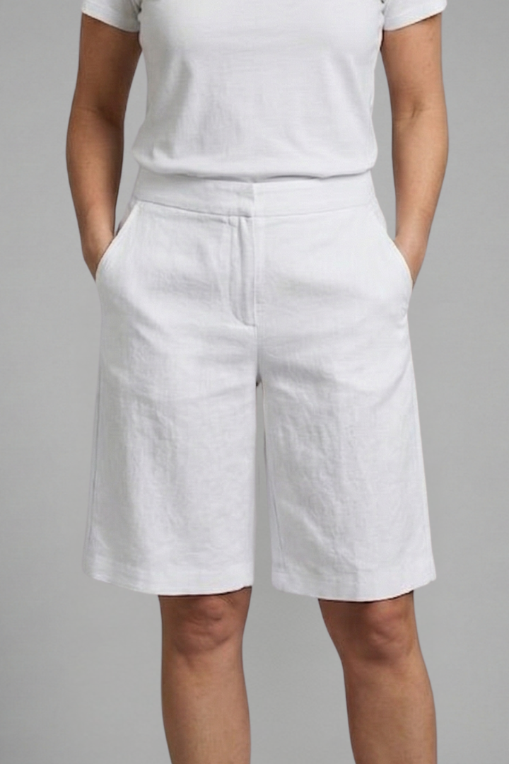 Relaxed fit women's knee-length shorts, featuring an elastic waistband & side pockets for ultimate comfort.