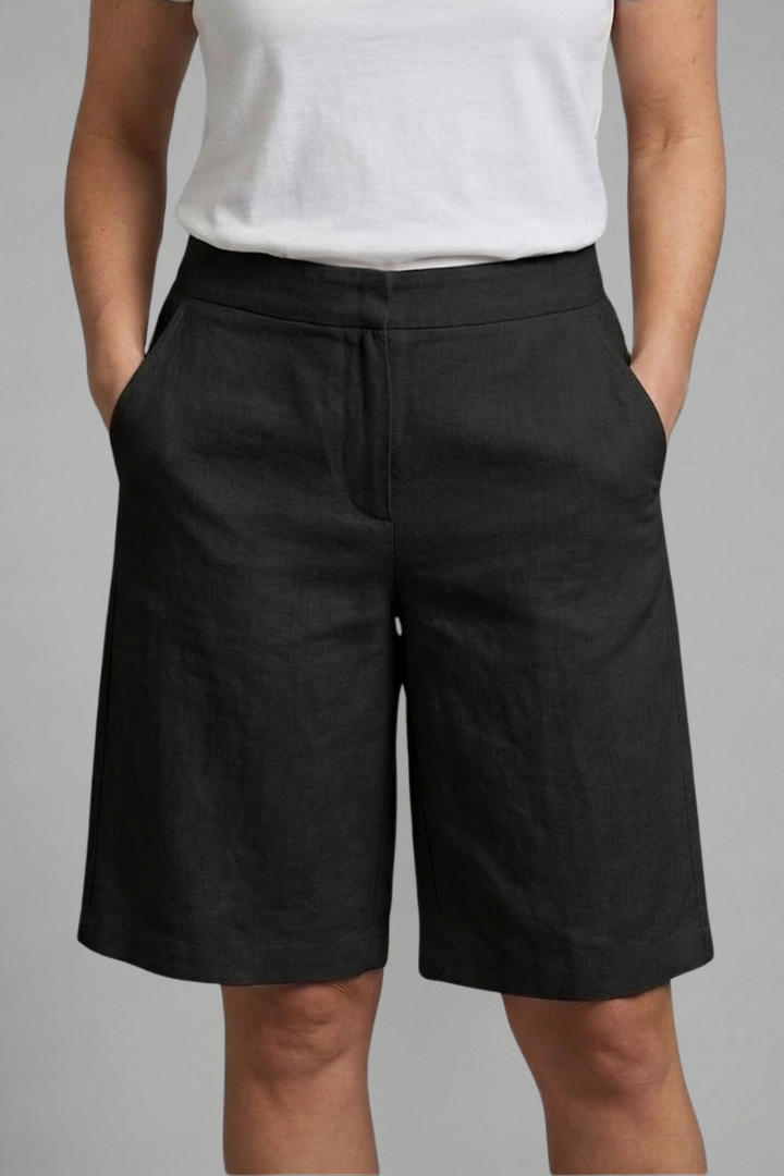 Comfortable knee-length women's shorts with elastic waist & pockets, perfect versatile option for summer.