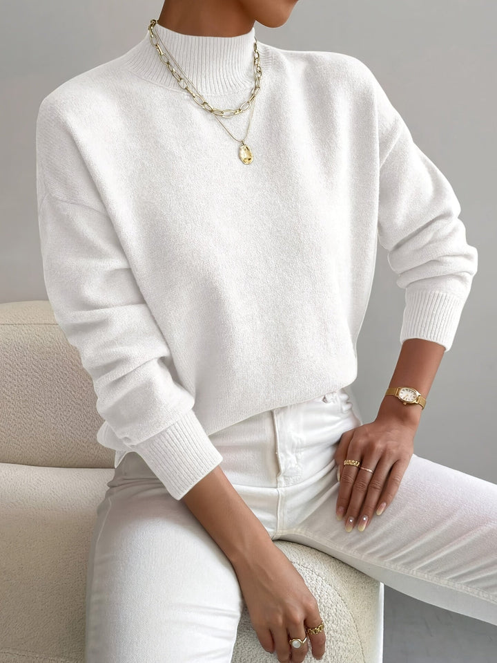 Soft knit long-sleeve mock neck sweater for women, perfect for comfortable spring outfits.