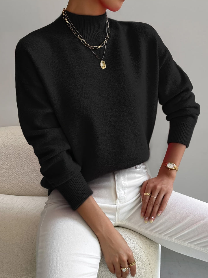Versatile women's mock neck knit pullover, offering comfort and style for spring dressing.