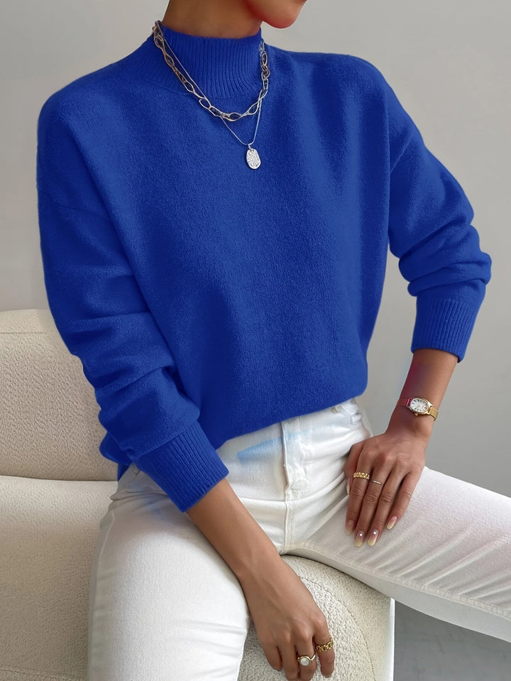 Spring-ready women's mock neck pullover, a comfortable and versatile long-sleeve knit sweater.
