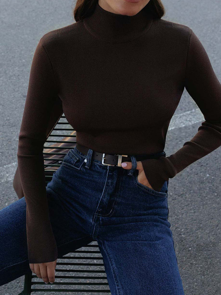 Wardrobe flat lay of a women's mock neck long sleeve top, great for everyday outfits