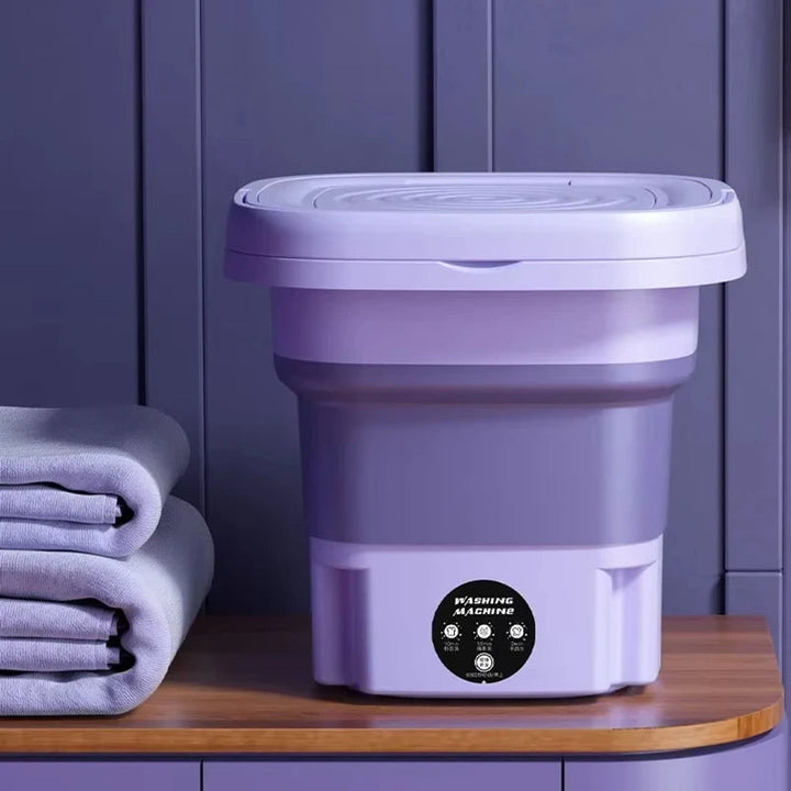 Compact foldable portable washing machine with spin dryer; small, efficient design, perfect for travel, apartments, or dorms.