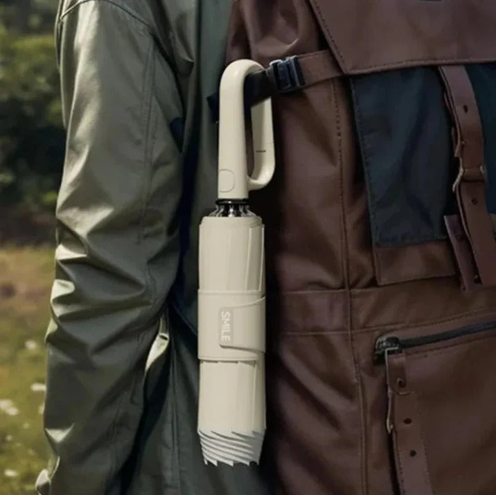 Reflective compact rain umbrella for safety in storms, providing strong windproof protection during travel.