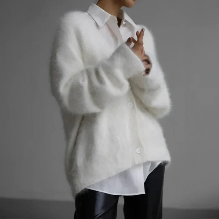 Soft platinum gray women's round neck sweater. Cozy knit top for stylish, elegant winter wear.