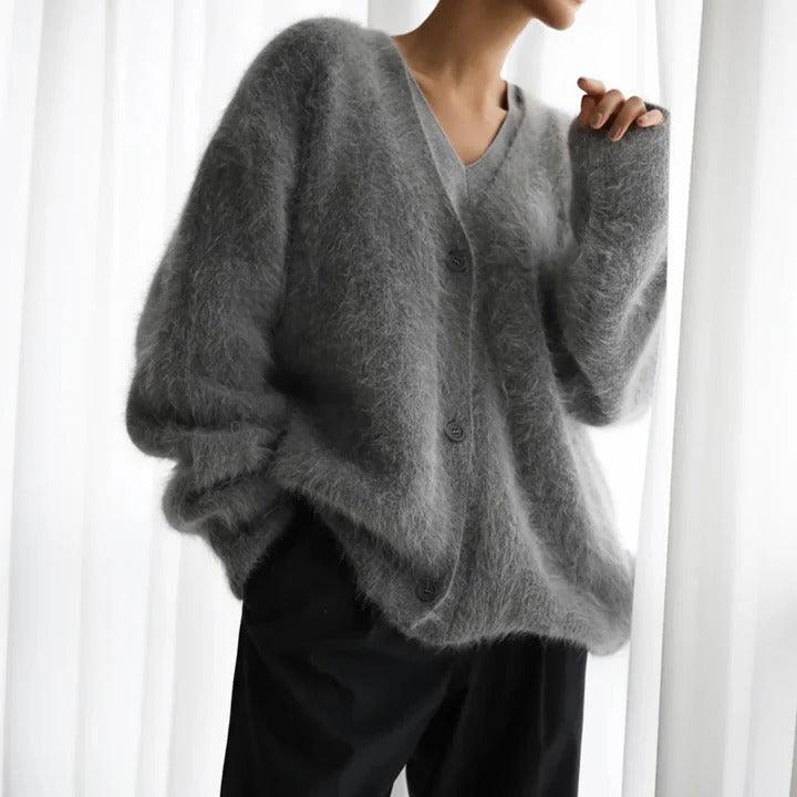 Elegant white women's long sleeve round neck knit sweater. Versatile top for cozy winter fashion.