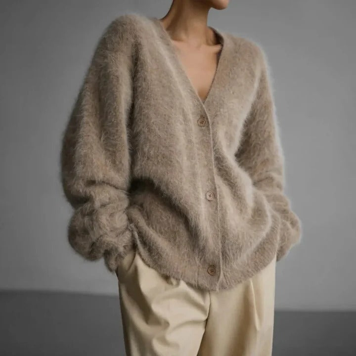 Versatile women's round neck knit sweater. Elegant long sleeve top in knitwear for cozy winter fashion.