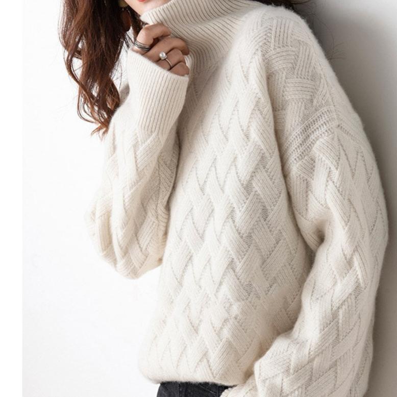 Dakota women's spring turtleneck sweater on model; lightweight knit for easy layering.