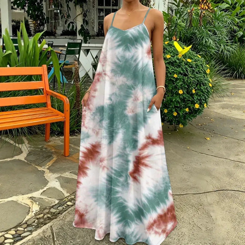 Women's tie-dye strappy maxi dress, flowing summer style. Perfect for beach or casual wear.