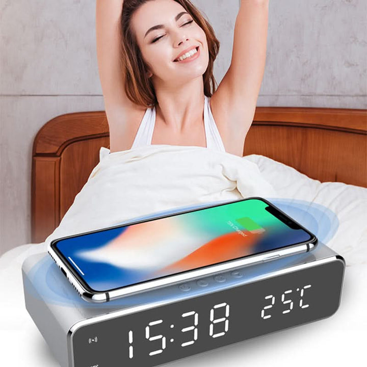 Contemporary LED digital alarm clock with large display & integrated wireless charger.