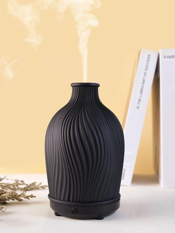 Elegant home aromatherapy diffuser & humidifier, essential for wellness, relaxation & air quality.