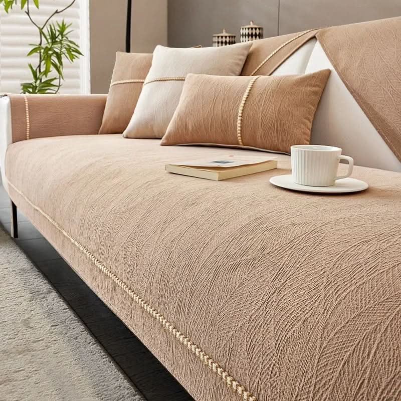 Modern linen textured non-slip sofa cover, a stylish furniture protector for a fresh living room look.